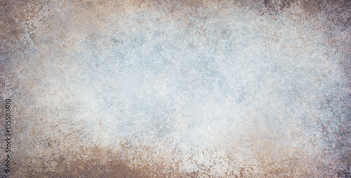 old stained blue and white background with dirty grunge textured borders and elegant rustic vintage style design with light center and dark grungy border