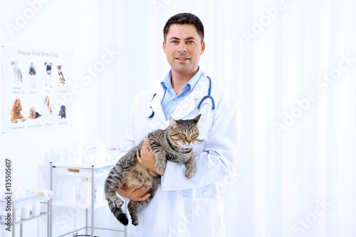 Handsome young veterinarian...