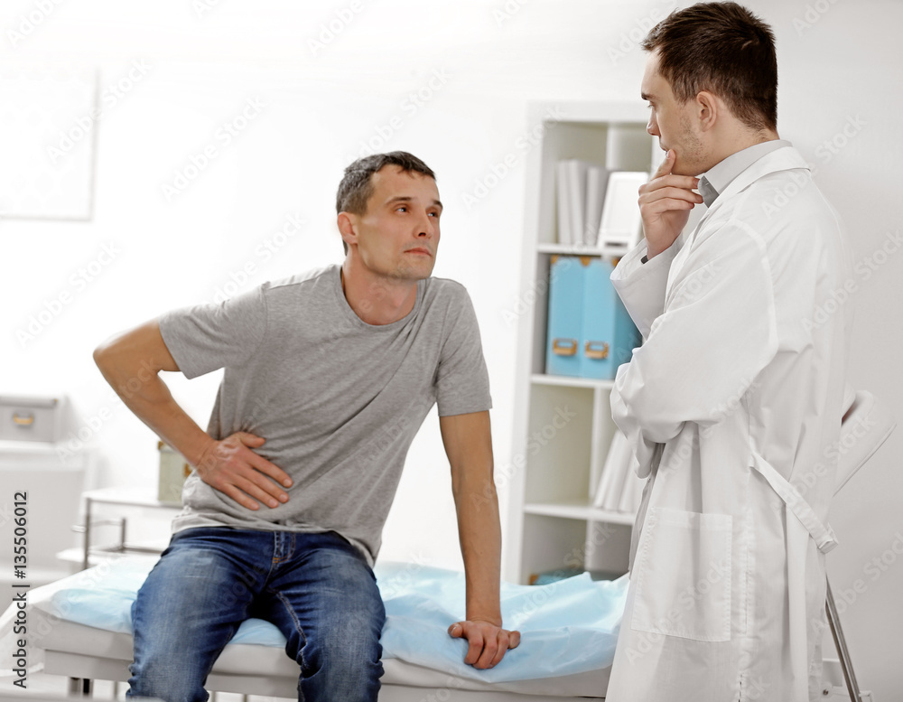 Fototapeta premium Patient talking with doctor at hospital