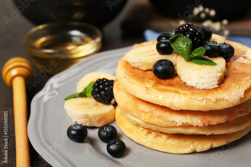 Stack of fresh pancakes with blueberry on plate