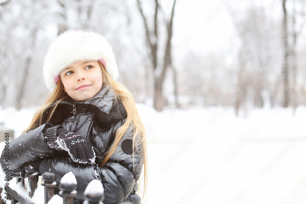 Portrait of cute little girl in winter park Portrait of cute little girl in winter park