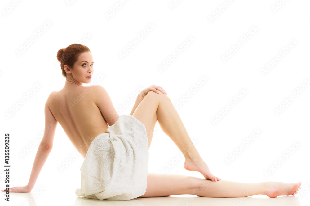 Sitting naked woman in white towel