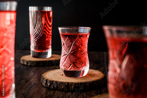 Turkish Ottoman Drink Rose sherbet or Cranberry Serbet in crystal glass photo