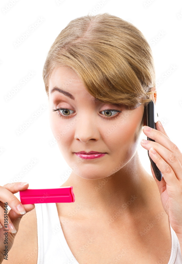 Worried woman with phone informing someone about positive pregnancy test Worried woman with phone informing someone about positive pregnancy test