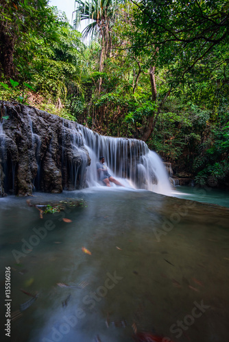 The woman in Huay Mae Kamin Waterfall in Kanchanaburi province  Thailand