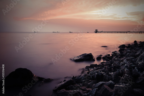Sunset seascape on the stone beach.