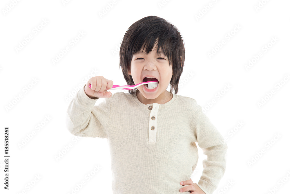 Cute asian boy brushing teeth on white background isolated Cute asian boy brushing teeth on white background isolated
