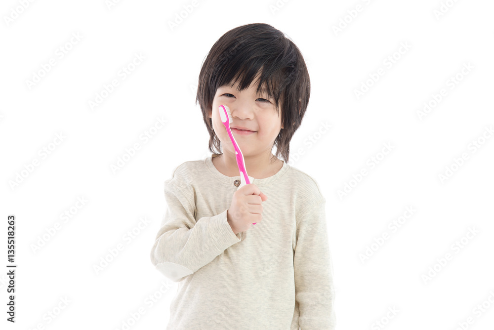 Cute asian boy brushing teeth on white background isolated Cute asian boy brushing teeth on white background isolated