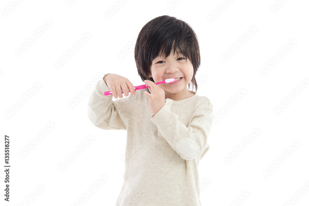 Cute asian boy brushing teeth on white background isolated Cute asian boy brushing teeth on white background isolated