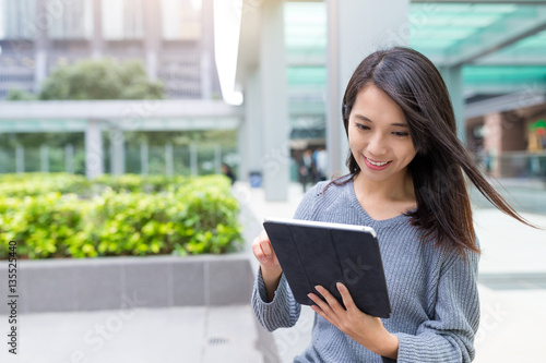 Woman using digital tablet