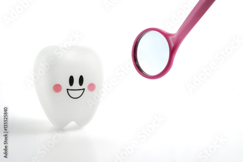 smiling teeth toy emotion with dental mirror pink isolated on white background, with clipping path