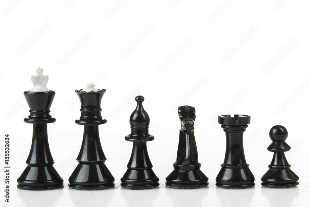 Blacr chess pieces lined up in a row on a white background isolated ...