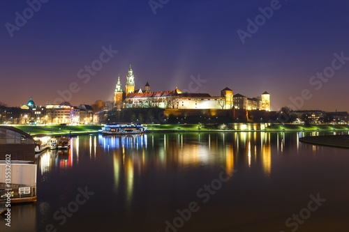 Wawel Castle in the evening in Krakow with reflection in the river  Poland. Long time exposure