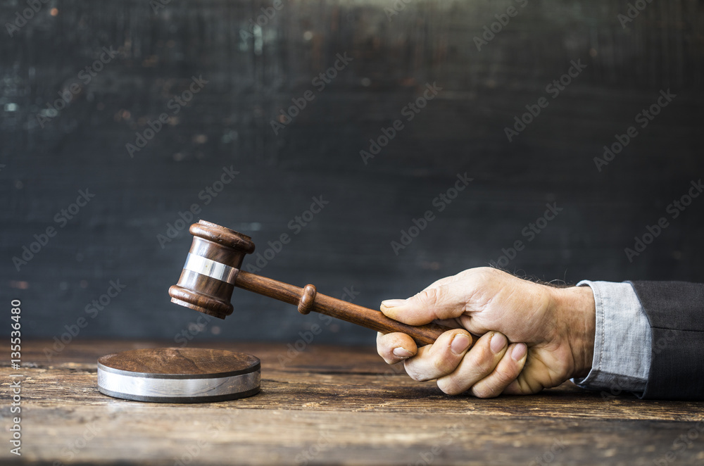 Judge with gavel on table Judge with gavel on table