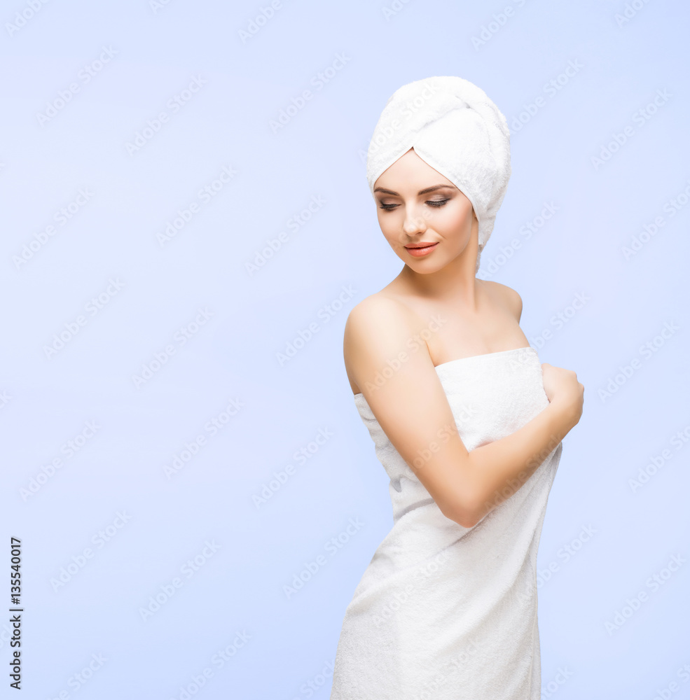 Young, beautiful and natural woman wrapped in towel isolated on Young, beautiful and natural woman wrapped in towel isolated on