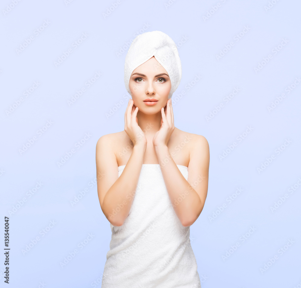 Young, beautiful and natural woman wrapped in towel isolated on Young, beautiful and natural woman wrapped in towel isolated on