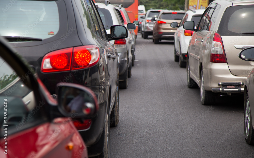 Close up of cars in a traffic jam on rush hour in a city Close up of cars in a traffic jam on rush hour in a city