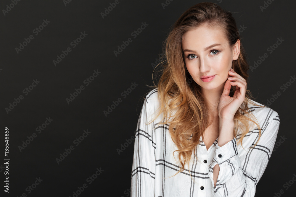 Beautiful lady posing over dark background Beautiful lady posing over dark background