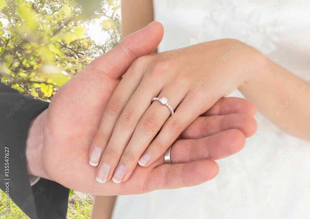 Fototapeta premium Newly wed couple holding hands