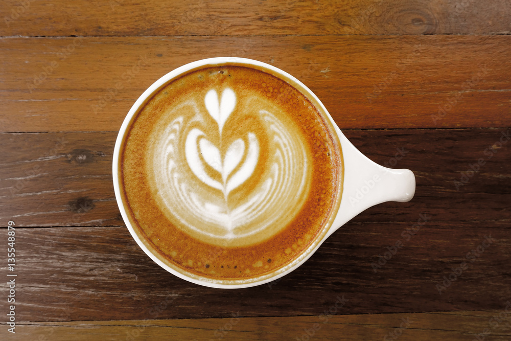 cup of latte art coffee on wooden background cup of latte art coffee on wooden background