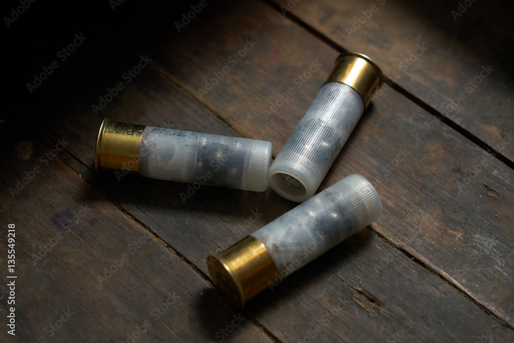 Hunting ammunition on wooden background.closeup