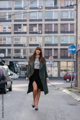 Businesswoman walking down the street