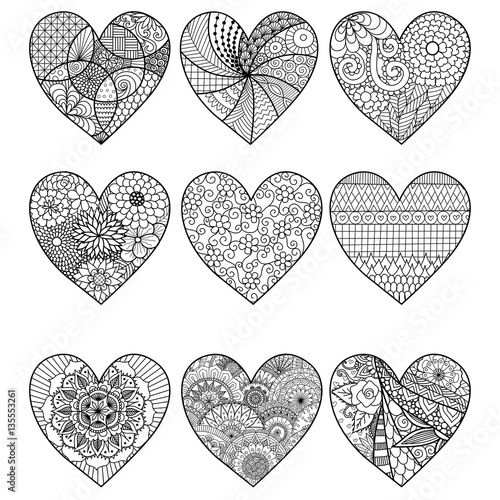 Nine zendoodle heart designs for adult coloring book pages and design element. photo