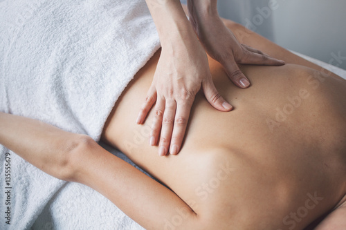 Fototapeta Naklejka Na Ścianę i Meble -  Young woman relaxing with hand massage at beauty spa.
