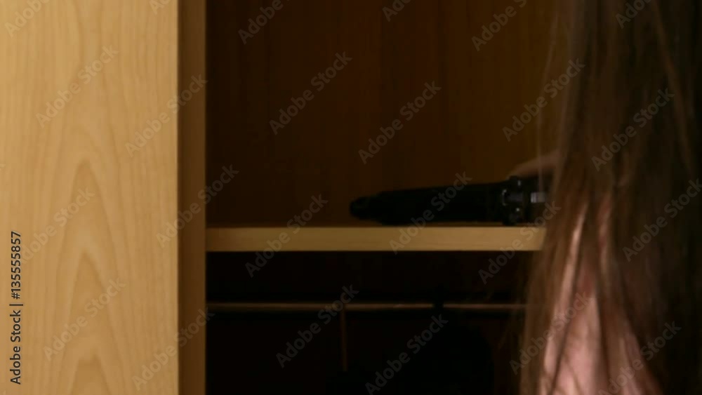 Young girl climbs and finds gun in cupboard Young girl climbs and finds gun in cupboard