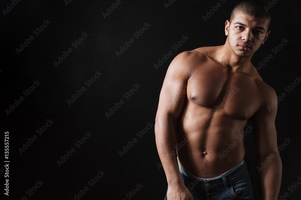Attractive young african sportsman posing