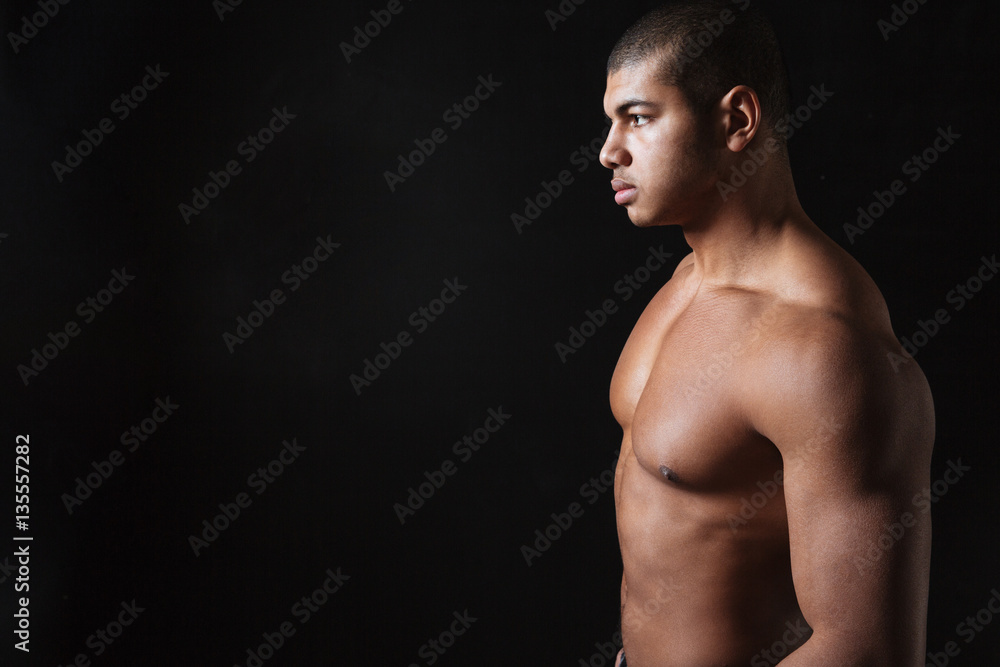 Attractive young african sportsman posing