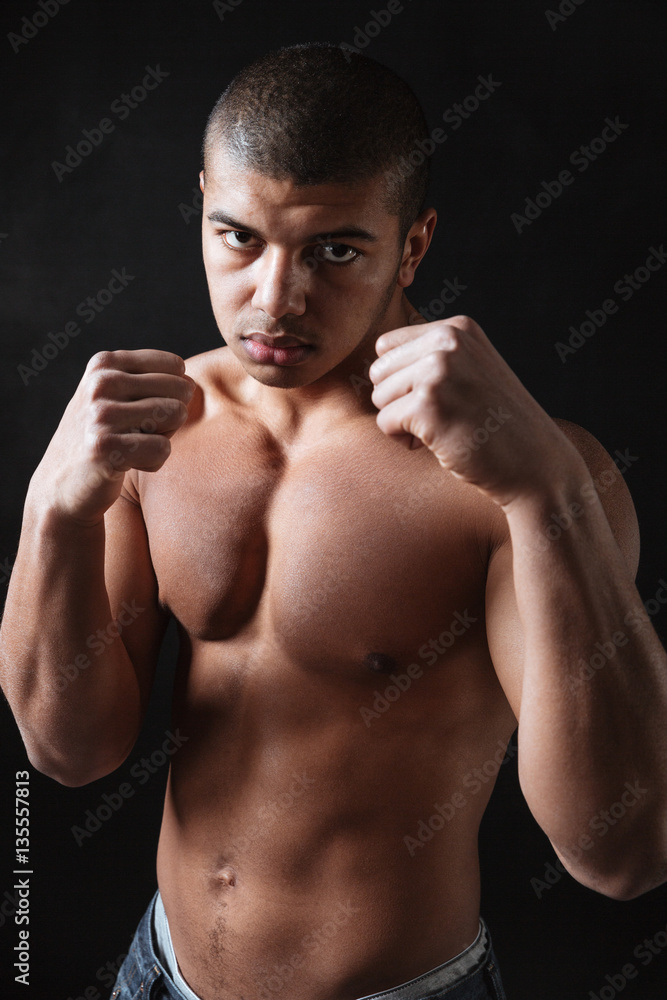 Attractive young african man boxer posing