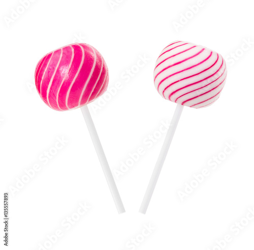 Two lollipop in form of ball with white and pink stripes