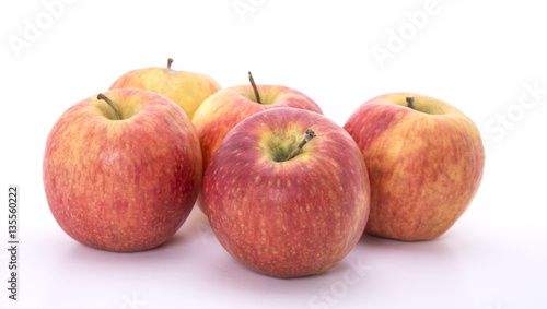 Five red apples on a white background