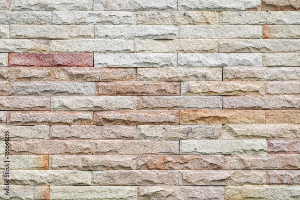 Obraz premium Sandstone brick wall texture background pattern and color