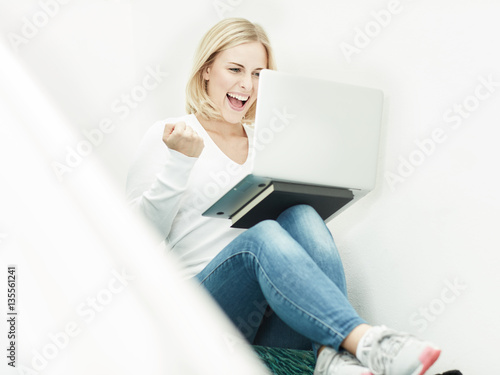 Woman works with laptop photo