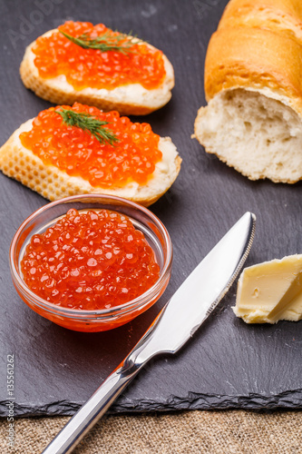 Bread with red roe, knife