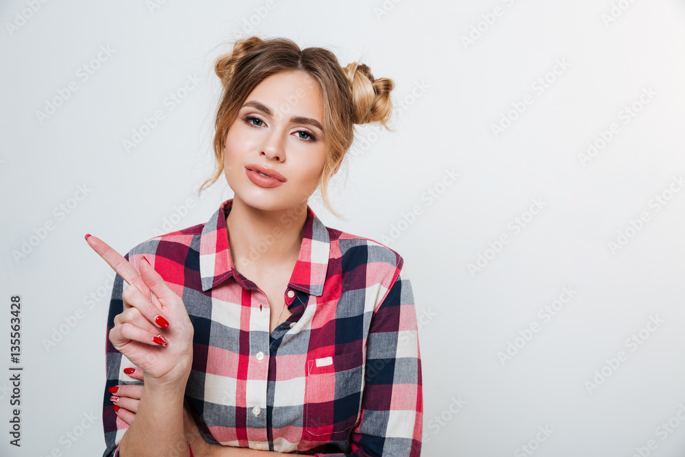 Woman in shirt pointing away Woman in shirt pointing away