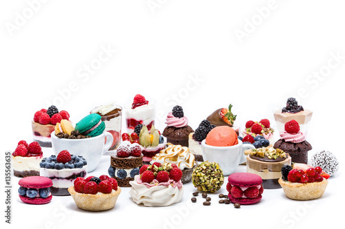 Selection of miniature cakes, macrons, cupcakes and treats