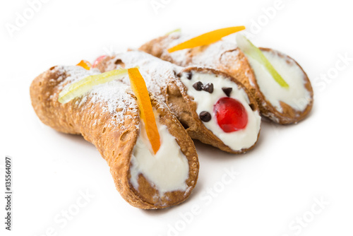 Sicilian cannoli  italian dessert with ricotta cheese  chocolate chips and candied fruit 