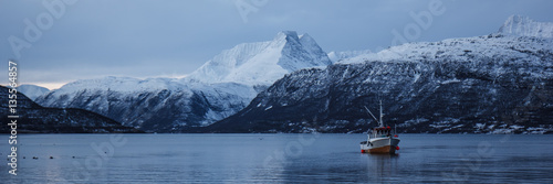 Boat in a winter fjord, Norway