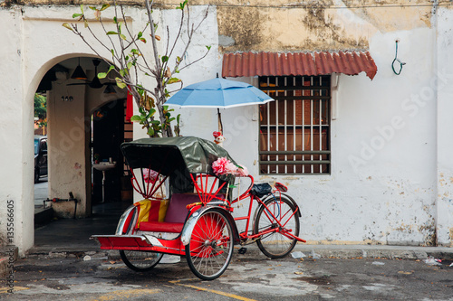 Rickshaw tricycle at the street of the George Town, Malaysia photo
