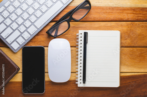 Office desk wood with computer  note book phone concept in wood background.Copy space.