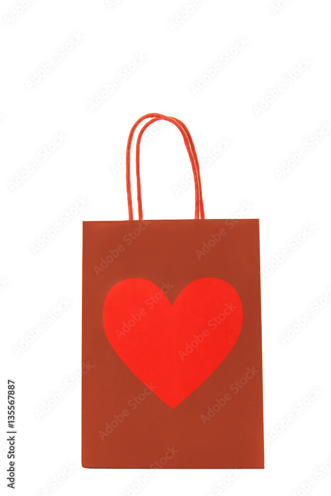 Red gift bag with a heart on it isolated on a white background Red gift bag with a heart on it isolated on a white background