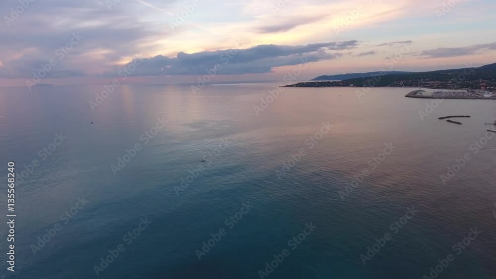 Aerial shot, incredibly beautiful calm sea in the sunset light with lots of clouds, filmed with drone Aerial shot, incredibly beautiful calm sea in the sunset light with lots of clouds, filmed with drone