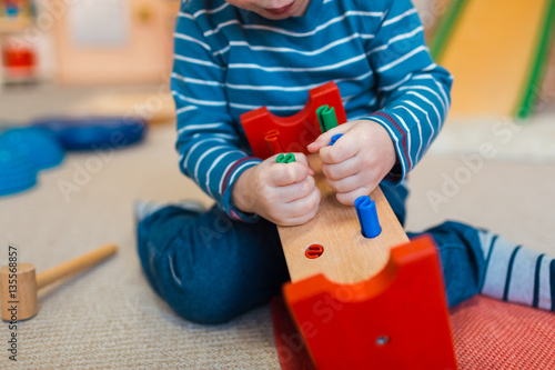 A child plays with educational games. Constructors