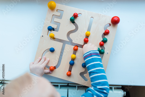 A child plays with educational games. Constructors