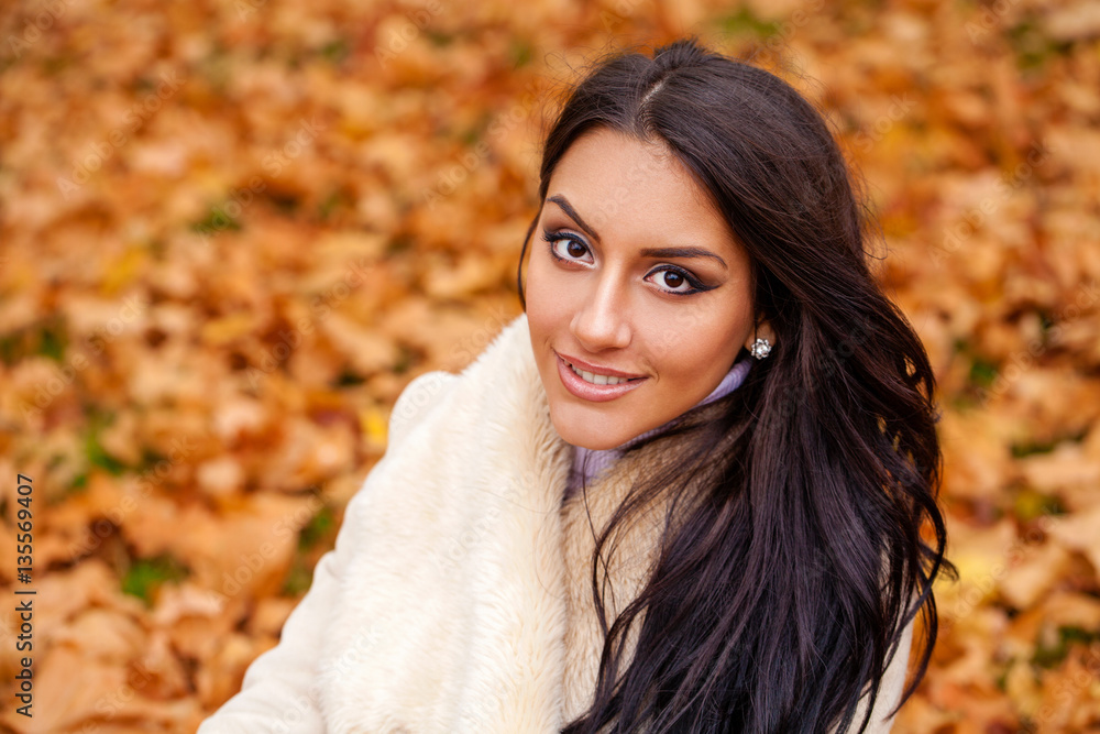 Beautiful arab woman warmly clothed autumn outdoor