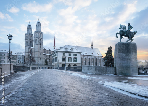 Winter landscape of Zurich. Waldmann monument and Munsterbrucke bridge  Switzerland