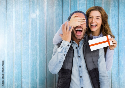 Photography Woman giving surprise gift to man
